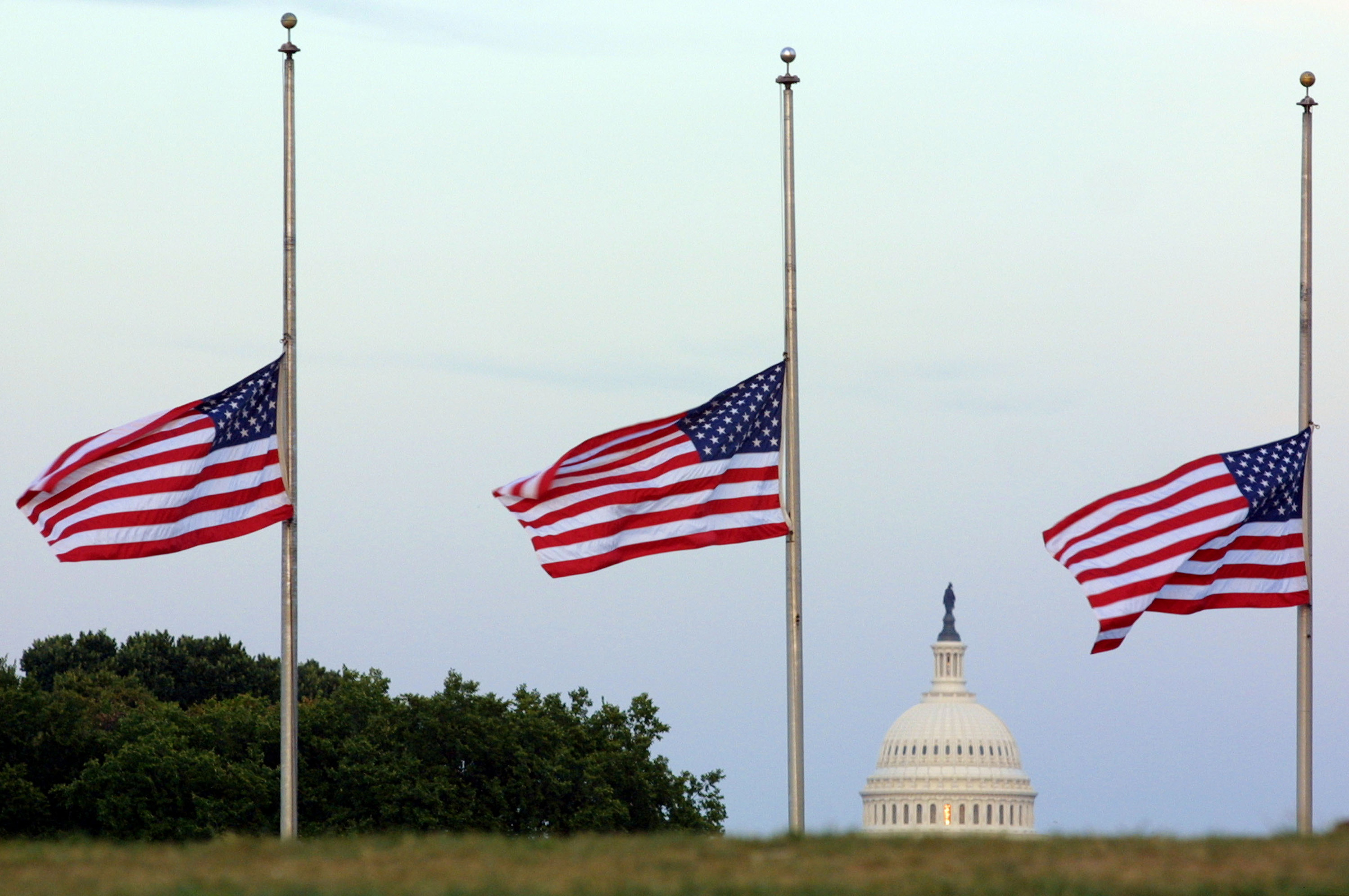 American flags fly at half mast on the grounds of the Washington Monument in memory of the victims of the terror attacks in New York City and at the Pentagon September 17, 2001 in Washington, DC. (Alex Wong—Getty Images)