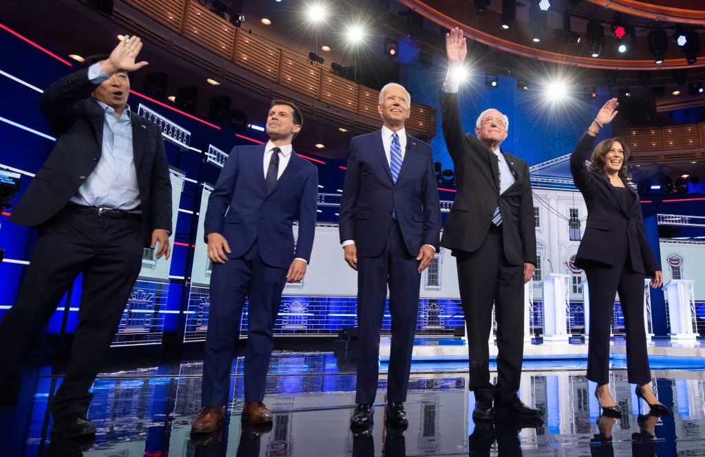 Entrepreneur Andrew Yang, Mayor of South Bend, Ind., Pete Buttigieg, Former Vice President Joe Biden, Vermont Sen. Bernie Sanders and California Sen. Kamala Harris arrive on stage for the second night of the first Democratic primary debate on June 27, 2019. (JIM WATSON—AFP/Getty Images)