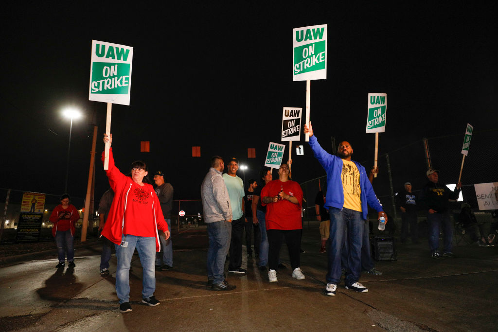 United Auto Workers (UAW) members picket line at a gate at the General Motors Flint Assembly Plant