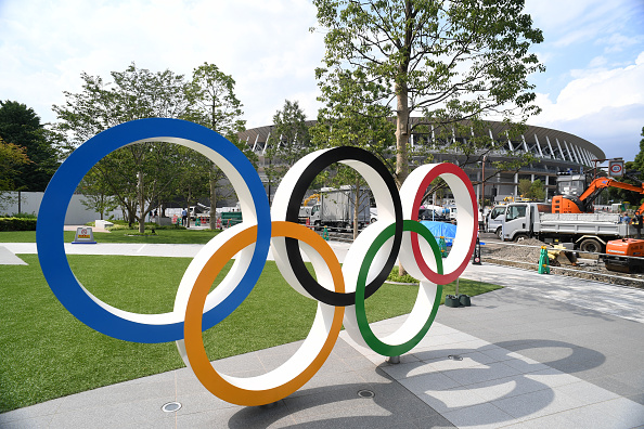 TOKYO, JAPAN - JULY 24: The Olympic Rings are displayed in front of the new national stadiumm which construction continues on the day marking the one year to go to the Tokyo 2020 Olympic Games on July 24, 2019 in Tokyo, Japan. (Photo by Etsuo Hara/Getty Images)