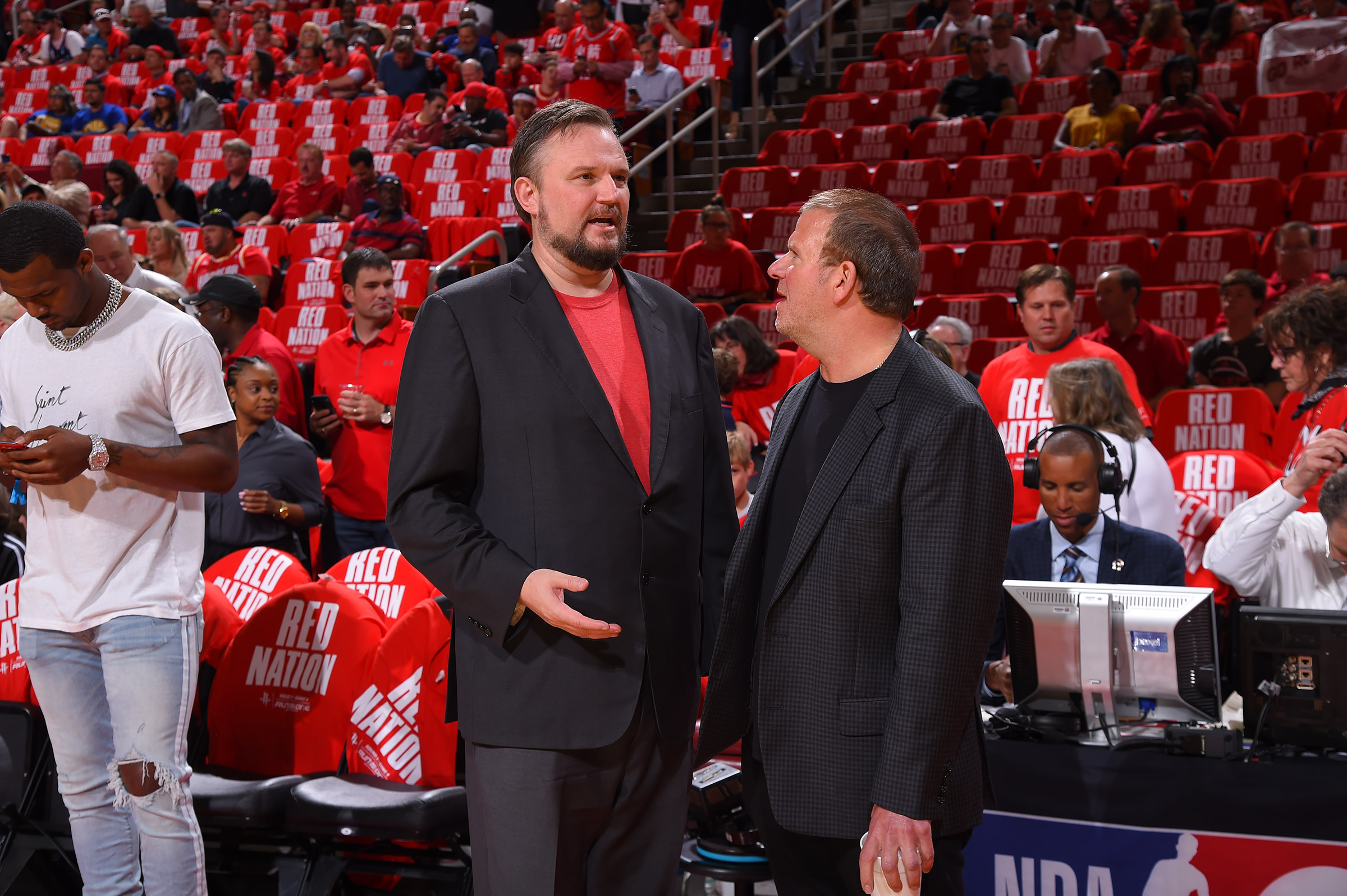 Houston Rockets General Manager Daryl Morey and Houston Rockets owner Tilman Fertitta speak during Game Four of the Western Conference Semifinals of the 2019 NBA Playoffs on May 6, 2019 in Houston. (Bill Baptist&mdash;NBAE/Getty Images)