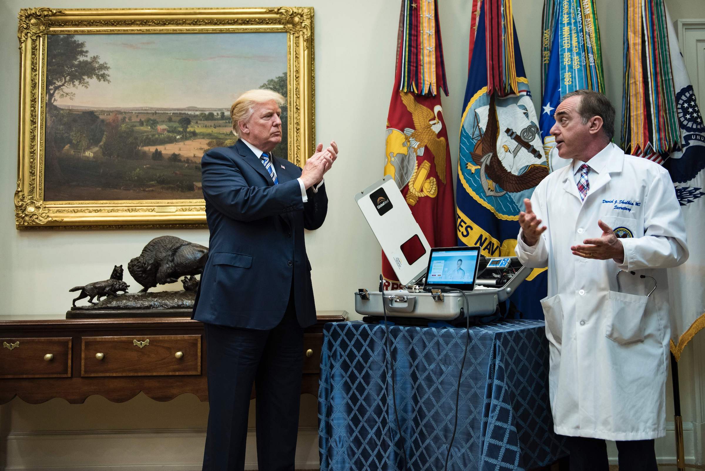President Donald Trump claps as Secretary of Veterans Affairs David J. Shulkin speaks about new technology used by the Department of Veterans Affairs during an event in the White House on Aug. 3, 2017.