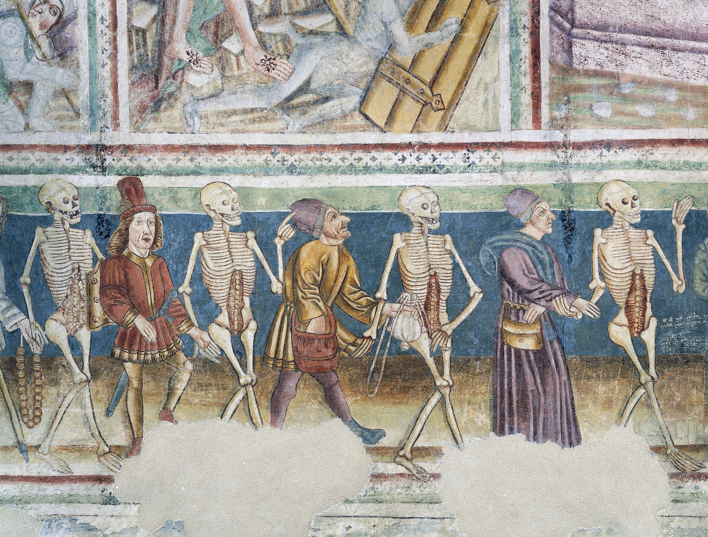 Death accompanying a merchant and a wealthy banker, detail from the Dance of Death (1490) frescoes by Janez Iz Kastva, Trinity Church, Hrastovlje, Slovenia. (DEA / A. DAGLI ORTI / De Agostini / Getty Images)