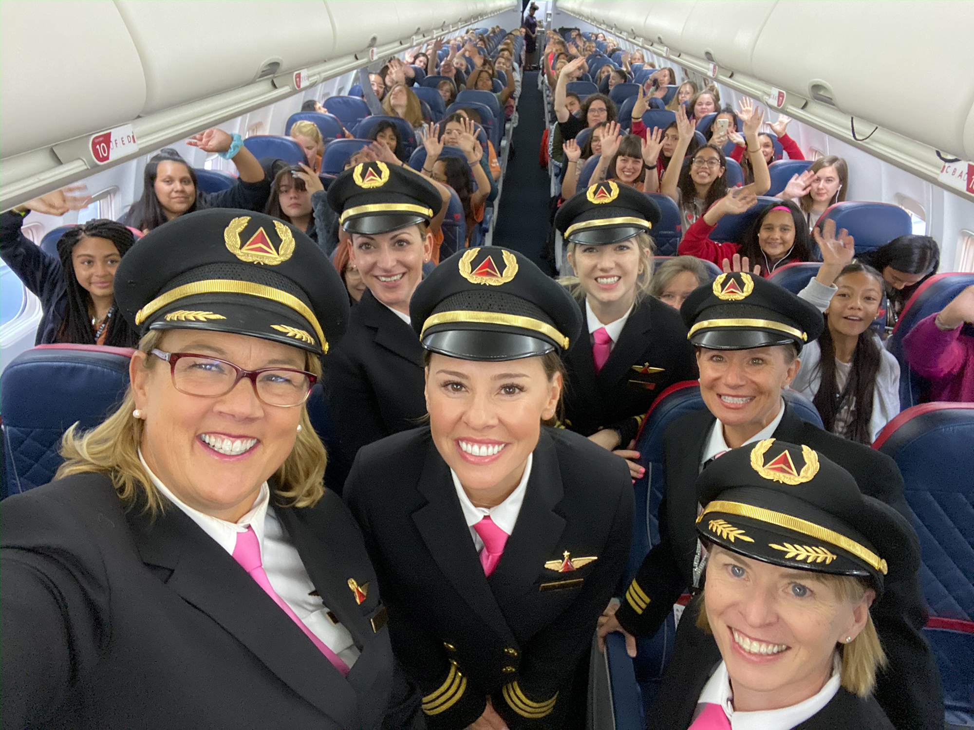 Female crew and passengers onboard a Delta flight headed to NASA in Houston in October 2019 as part of the company's initiative to close the gender gap in aviation. (Delta News Hub)