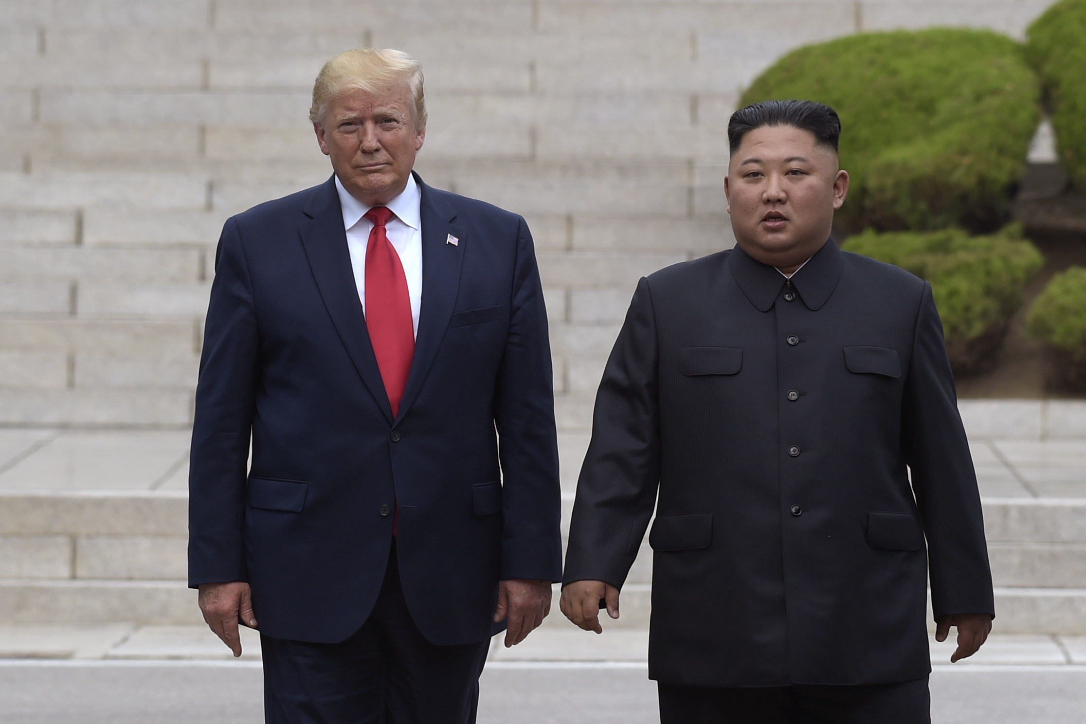 U.S. President Donald Trump, left, meets with North Korean leader Kim Jong Un at the North Korean side of the border at the village of Panmunjom in Demilitarized Zone on June 30, 2019. A senior North Korean diplomat on Tuesday, Oct. 1, 2019, says North Korea and the United States have agreed to resume nuclear negotiations on Oct. 5 following a months-long stalemate over withdrawal of sanctions in exchange for disarmament. (AP Photo/Susan Walsh, File) (Susan Walsh&mdash;AP)