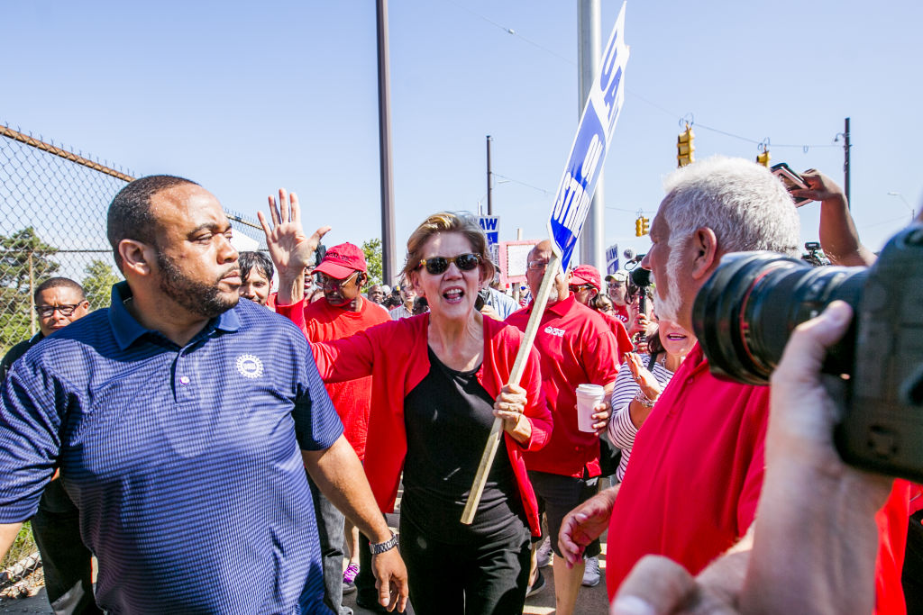 Senator Elizabeth Warren, a 2020 presidential candidate, walks the picket line during a United Auto Workers strike outside the General Motors Co. Detroit-Hamtramck Assembly plant in Detroit, Michigan, on Sept. 22, 2019. (Anthony Lanzilote&mdash;Bloomberg/Getty Images)