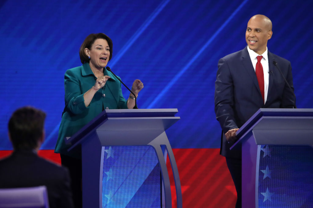 Democratic presidential candidate Sen. Amy Klobuchar speaks as Sen. Cory Booker looks on during the Democratic Presidential Debate at Texas Southern University's Health and PE Center on September 12, 2019 in Houston, Texas. (Win McNamee—Getty Images)