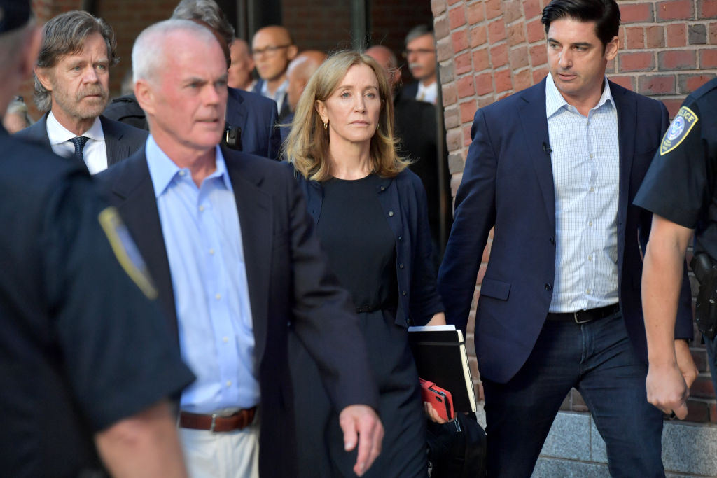 Felicity Huffman and husband William Macy exit John Moakley U.S. Courthouse where Huffman received a 14 day sentence for her role in the college admissions scandal on September 13, 2019 in Boston, Massachusetts. (Paul Marotta&mdash;Getty Images)