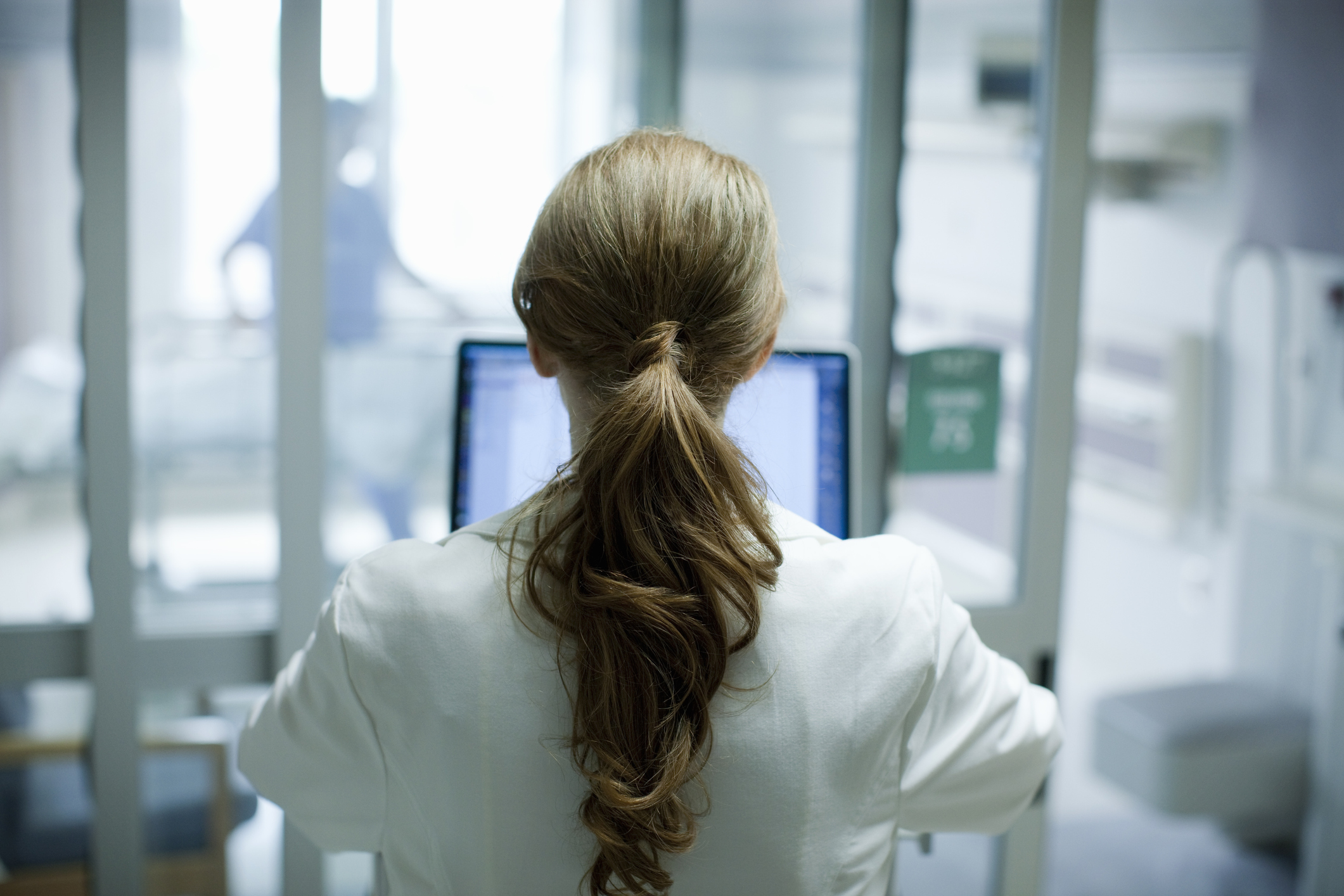 Female doctor using laptop in hospital