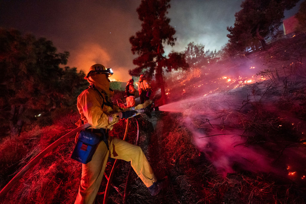 Firefighters work near Getty Center in Los Angeles Oct. 28, 2019. Thousands of residents were forced to evacuate their homes after a fast-moving wildfire erupted early Monday morning near the famous Getty Center. (Xinhua News Agency—Xinhua News Agency/Getty Images)