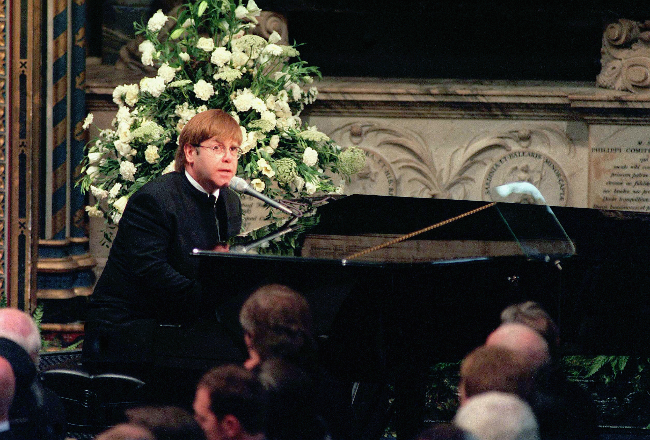 Sir Elton John sings 'Candle in the Wind' at the funeral of Diana, Princess of Wales at Westminster Abbey in 1997 (Anwar Hussein&mdash;Getty Images)