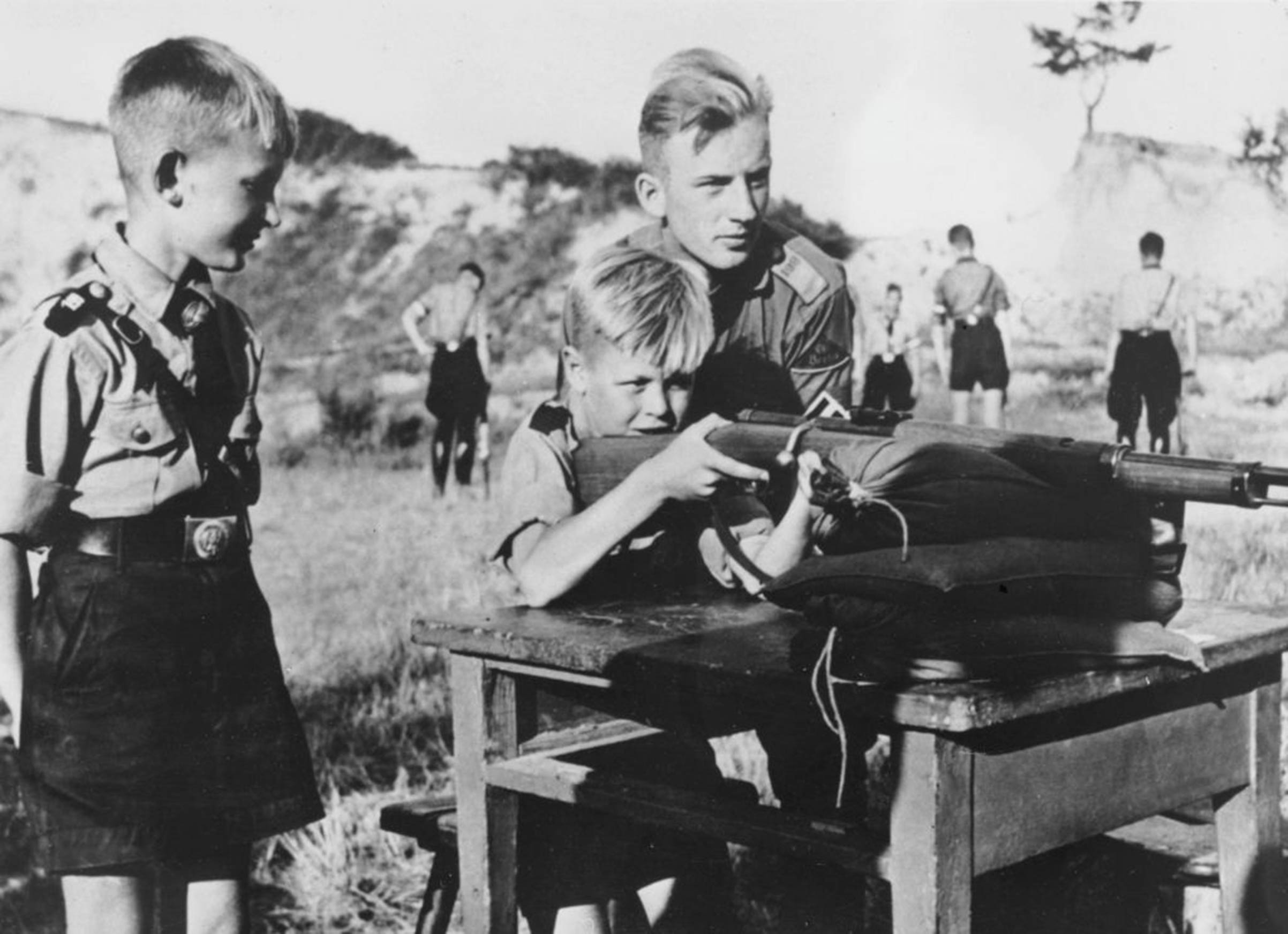 Eleven-year-old boys in the Hitler Youth organization learning how to fire a rifle. (Keystone—Getty Images)