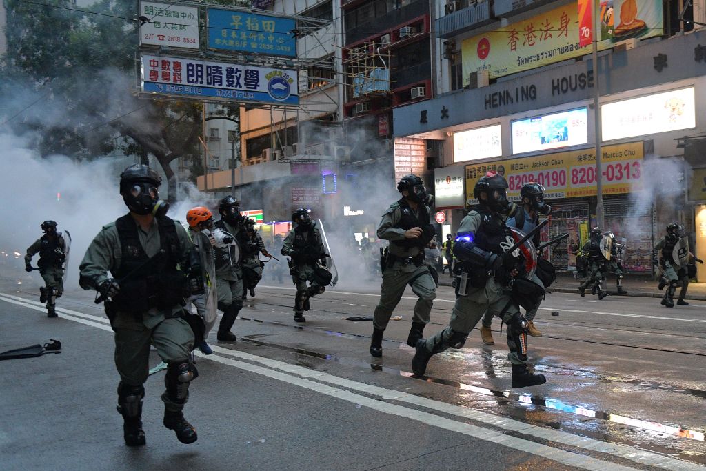 Hong Kong police advance on protesters during clashes in Hong Kong on Oct. 6, 2019. (Nicolas Asfouri—AFP/Getty Images)