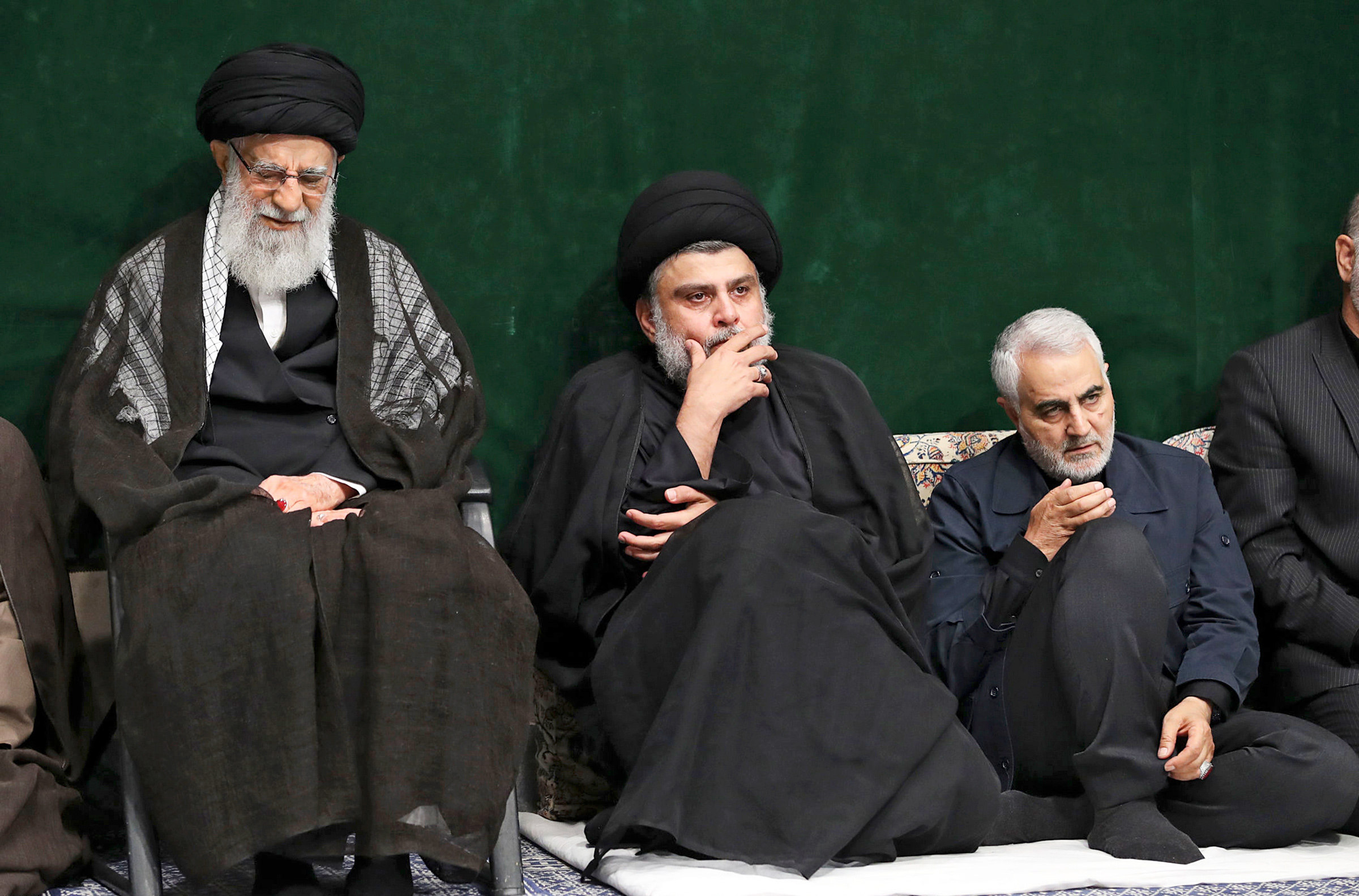 Khamenei and Qasem Soleimani flank Iraqi cleric Muqtada al-Sadr at a Tehran mourning ceremony on Sept. 10 (Office of the Iranian Supreme Leader/AP)