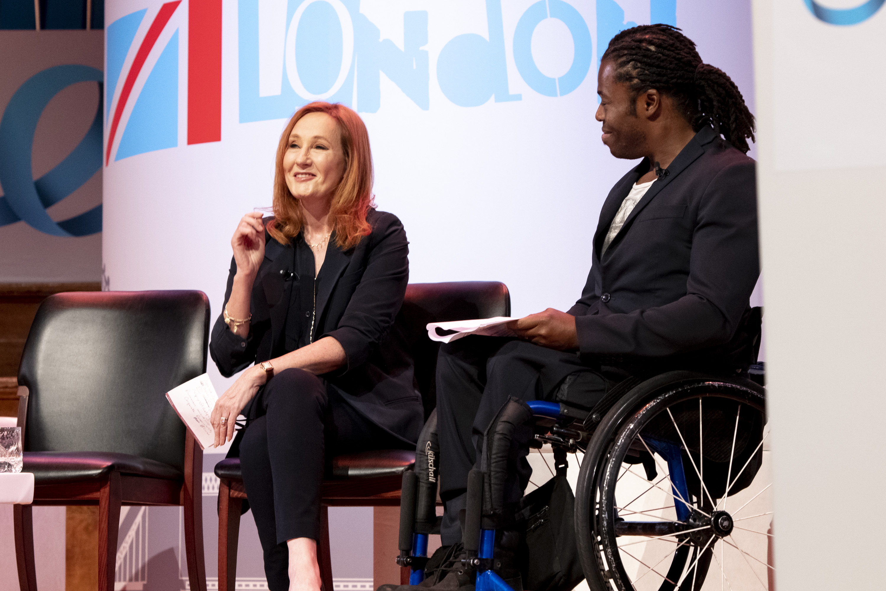 The author J.K. Rowling alongside U.K. paralympian Ade Adepitan at the One Young World global forum in London on Oct. 24 (Richard Hanson—HansonImages)