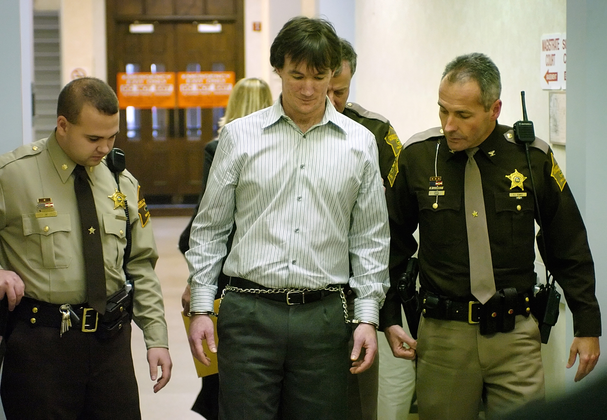 John Myers II, center, is escorted from the Morgan County Courthouse Friday, Dec. 1, 2006, after receiving a sentence of 65 years in prison for the murder Jill Behrman, 19, in May 2000. (Chris Howell—The Herald-Times/AP)