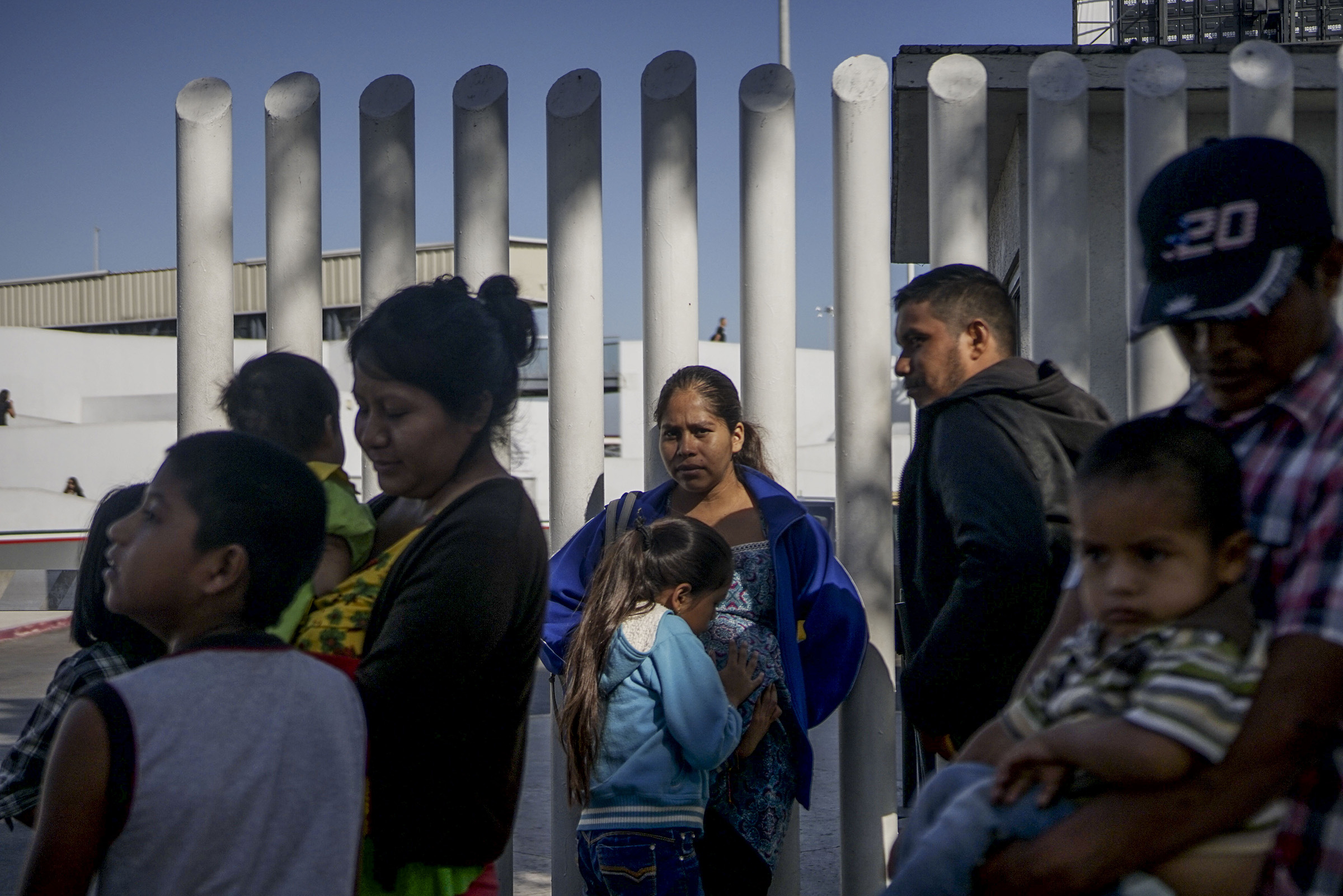 Migrants wait in line at the Mexico-United States border crossing in Tijuana, Mexico on September 12, 2019. (Sandy Huffaker—AFP/Getty Images)