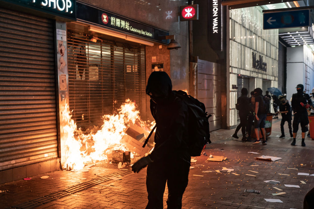 Pro-democracy protesters set a fire at the entrance of a subway station in Hong Kong on Oct. 4, 2019. (Anthony Kwan—Getty Images)
