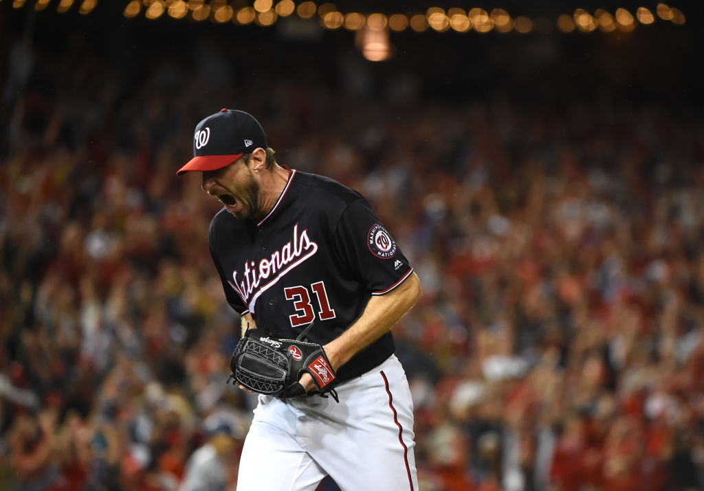 Max Scherzer #31 of the Washington Nationals celebrates as he walks back to the dug out after the last out with bases loaded in the seventh inning of game four of the National League Division Series against the Los Angeles Dodgers at Nationals Park on October 07, 2019 in Washington, D.C. (Will Newton&mdash;Getty Images)