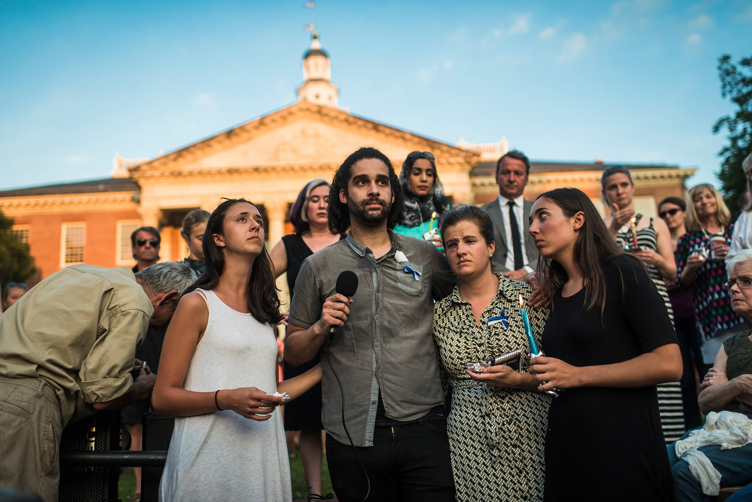 From left: Danielle Ohl, Phil Davis, Rachael Pacella and Selene San Felice—reporters at the Capital Gazette—address the crowd during a June 29, 2018, vigil for the victims of the newsroom shooting in Annapolis, Md. (Ryan Christopher Jones—The New York Times/Redux)