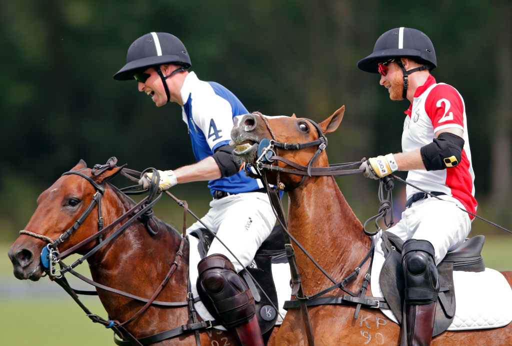 Prince William, Duke of Cambridge and Prince Harry, Duke of Sussex take part in the King Power Royal Charity Polo Match for the Khun Vichai Srivaddhanaprabha Memorial Polo Trophy at Billingbear Polo Club on July 10, 2019 in Wokingham, England. (Max Mumby—Indigo/Getty Images)