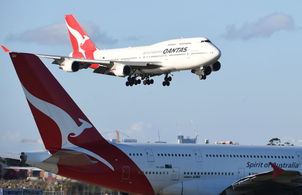 Qantas flight number 4 from Honolulu, a Boeing 747-400 aircraft flies over a Qantas A380 aircraft as she arrives at Sydney Airport on September 30, 2018 in Sydney, Australia. Friday’s flight from New York is a key test for Qantas as it prepares to start direct commercial services to Sydney as soon as 2022. (James D. Morgan&mdash;Getty Images)