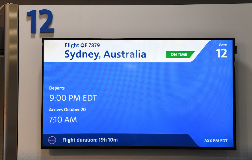 Flight departure screens at JFK airport for QF7879 on Oct. 18, 2019 in New York, NY. Qantas is the first commercial airline to ever fly direct from New York to Sydney. (James D. Morgan—Getty Imagess)