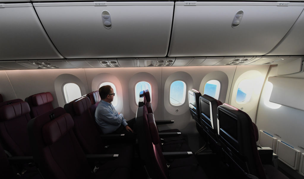Alan Joyce, Qantas Group CEO sits onboard Qantas flight 7879 as the sun rises in Australia after flying 19 hours and 16 minutes from New York to Sydney on October 20, 2019 in Sydney, Australia. (James D. Morgan—Getty Images for Qantas)
