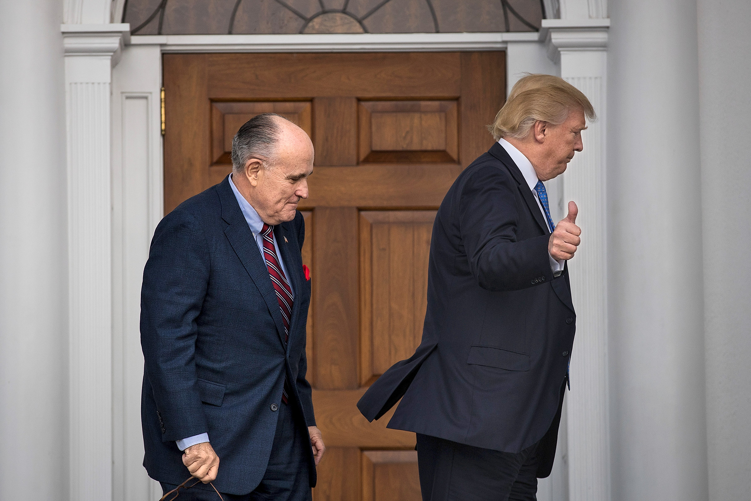 Trump and Giuliani walk out of Trump’s golf club in Bedminster, N.J. on Nov. 20, 2016 (Drew Angerer—Getty Images)