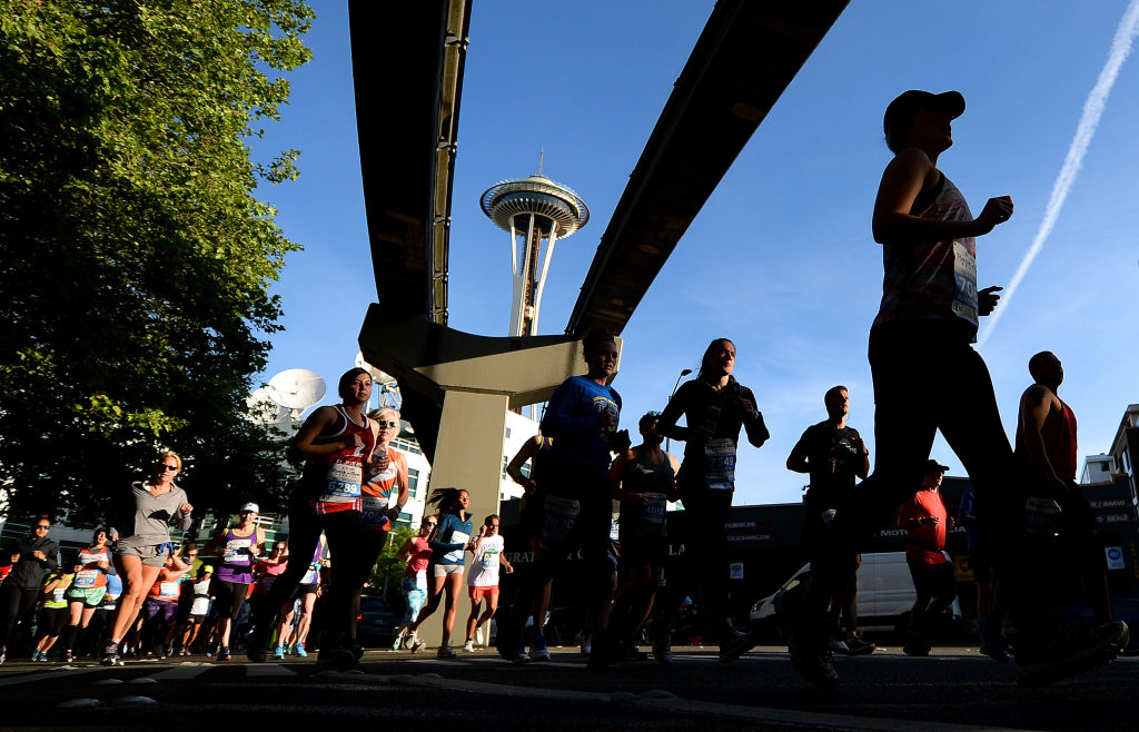 Competitors run with the monorail and Space Needle in the background during the 2019 Rock'n'Roll Seattle Marathon and 1/2 Marathon on June 9, 2019 in Seattle, Washington. (Donald Miralle&mdash;Getty Images for Rock'n'Roll Mar)