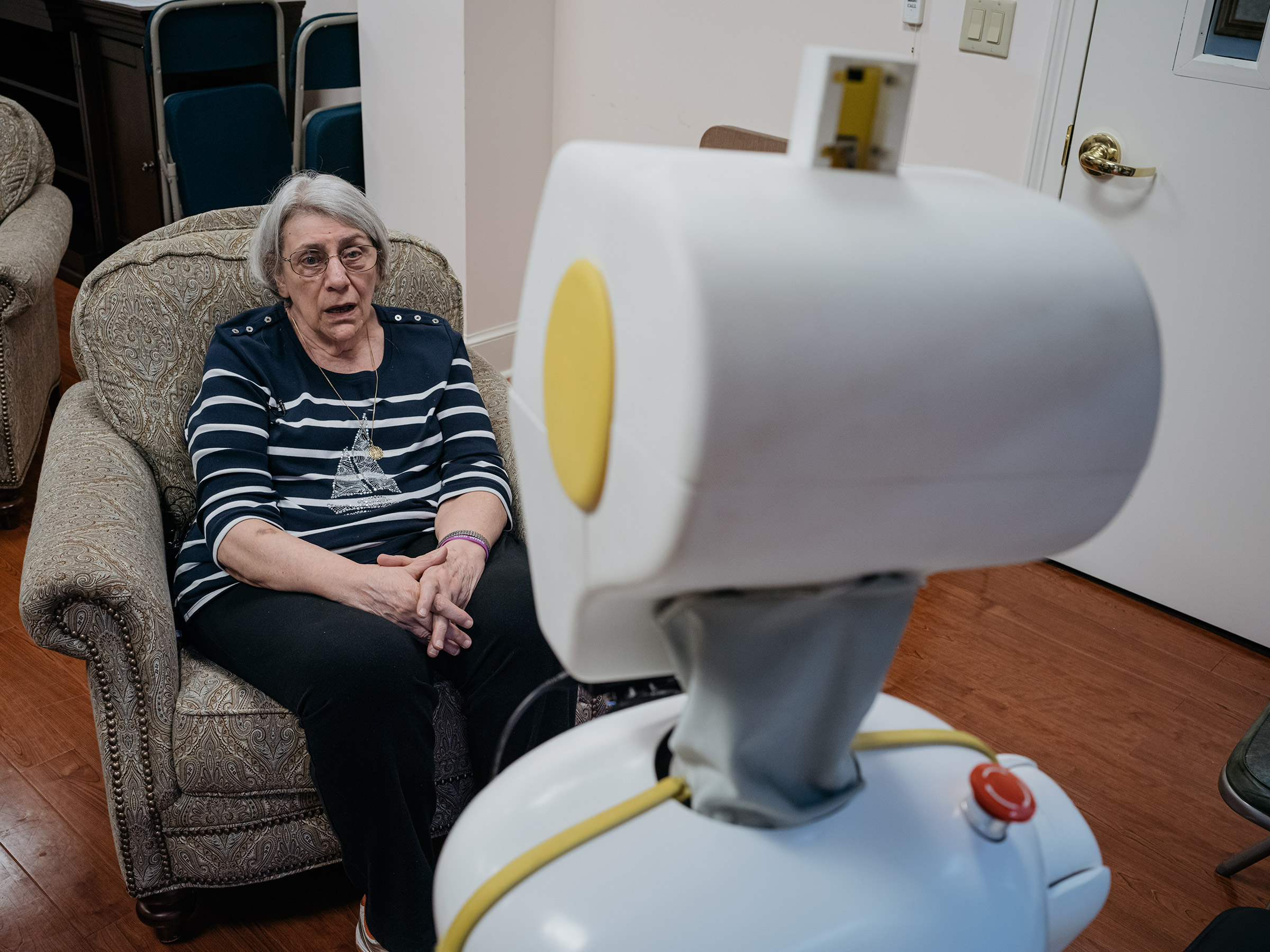 Stevie talks with Betty Bernard while researchers monitor the conversation at Knollwood Military Retirement Community in Washington, D.C. (Greg Kahn for TIME)