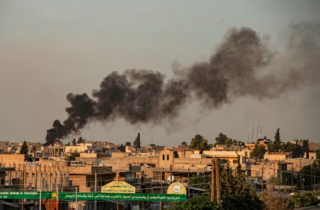 Smoke billows following Turkish bombardment on Syria's northeastern town of Ras al-Ain in the Hasakeh province along the Turkish border on October 9, 2019. (Delil Souleiman&mdash;AFP via Getty Images)