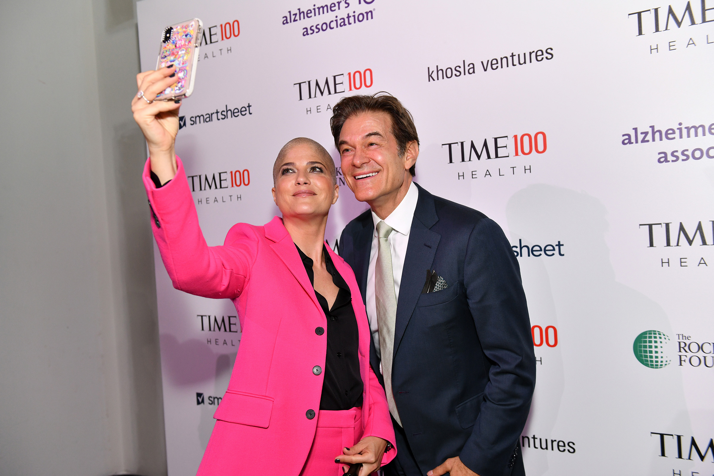 Actor Selma Blair (L) and and Dr. Mehmet Oz arrive at the TIME 100 Health Summit at Pier 17 in New York City on Oct. 17, 2019. (Craig Barritt—Getty Images for TIME 100 Health)