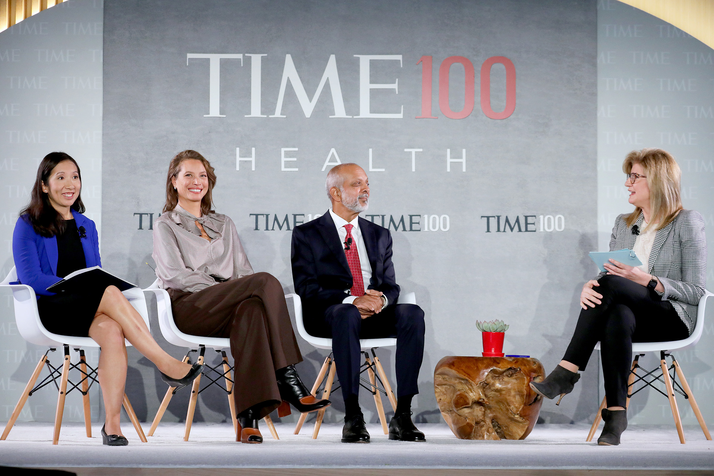 (L-R) Dr. Leana Wen, Christy Turlington Burns, Dr. Naveen Rao and Arianna Huffington speak onstage during the TIME 100 Health Summit at Pier 17 in New York City on Oct. 17, 2019. (Brian Ach—Getty Images for TIME 100 Health)
