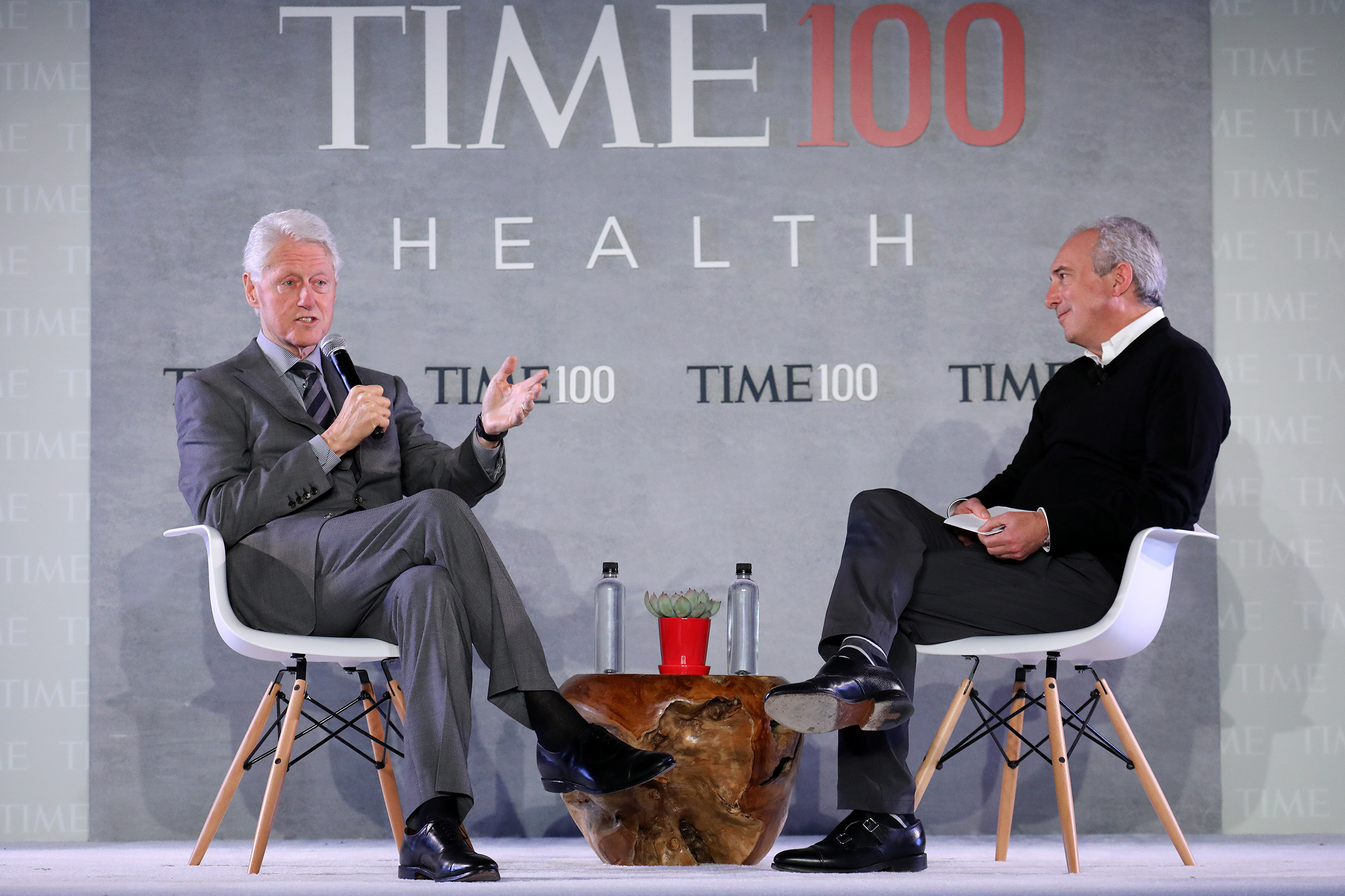 Former U.S. President Bill Clinton (L) speaks with Dr. David Agus,  CEO of the Lawrence J. Ellison Institute for Transformative.Medicine at USC during the TIME 100 Health Summit at Pier 17 in New York City on Oct. 17, 2019. (Brian Ach—Getty Images for TIME 100 Health)