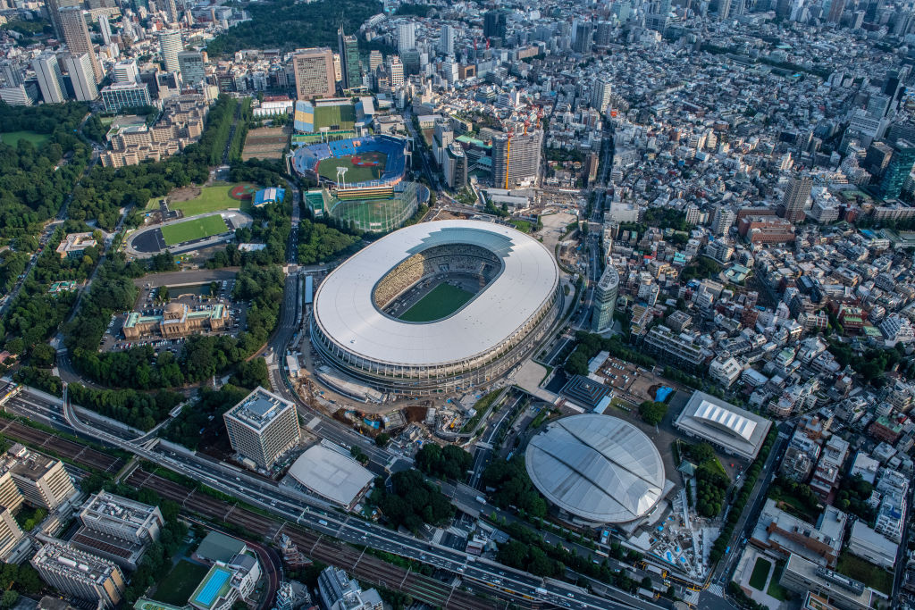 The New National Stadium, the main stadium for the Tokyo 2020 Olympics, and the Tokyo Metropolitan Gymnasium (bottom right) are pictured on July 24, 2019 in Tokyo, Japan. (Carl Court—Getty Images)