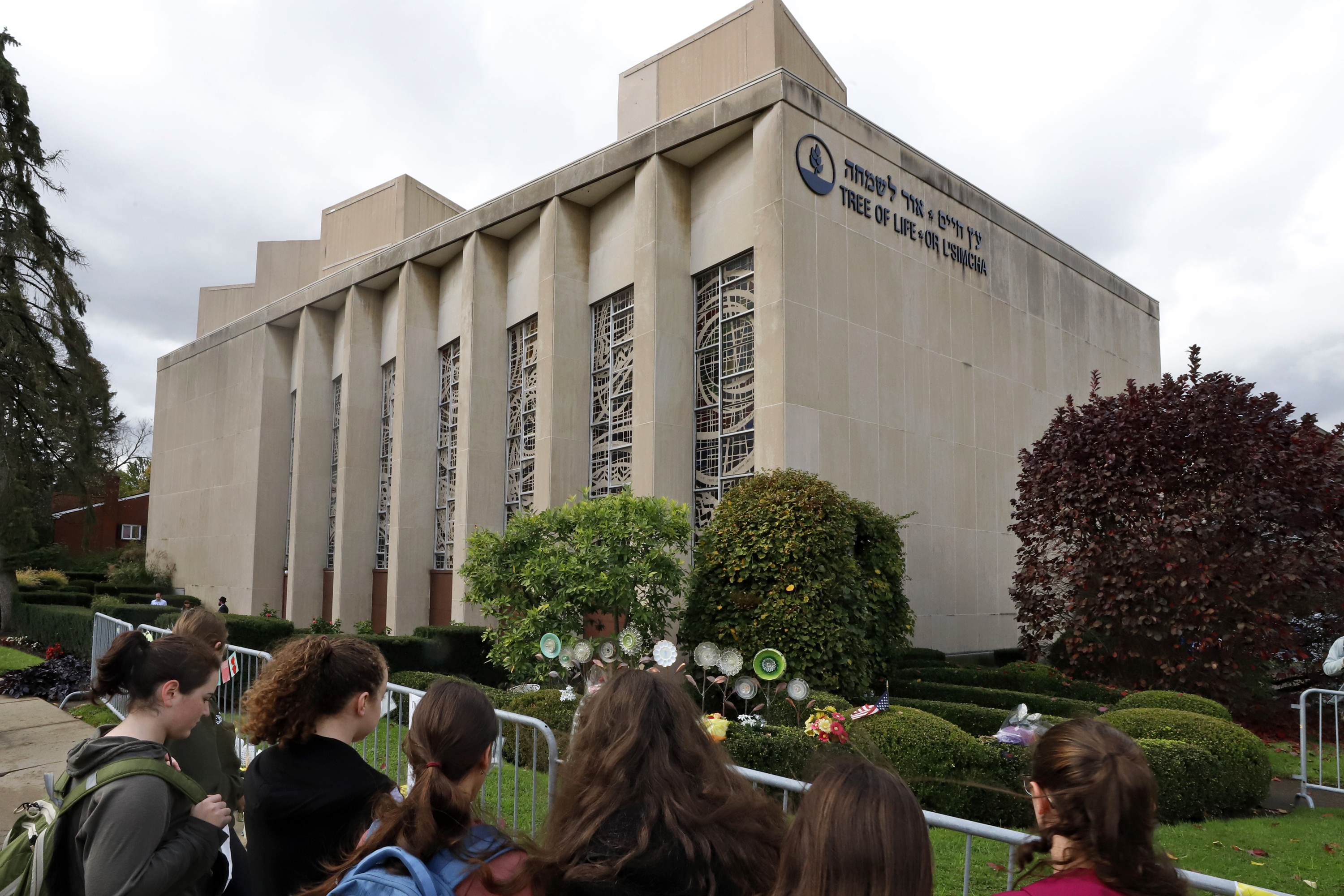 A group of students from a Pittsburgh Yeshiva school gather outside the Tree of Life synagogue in Pittsburgh on Sunday, Oct. 27, 2019, the first anniversary of the shooting at the synagogue, that killed 11 worshippers. (Gene J. Puskar—AP)