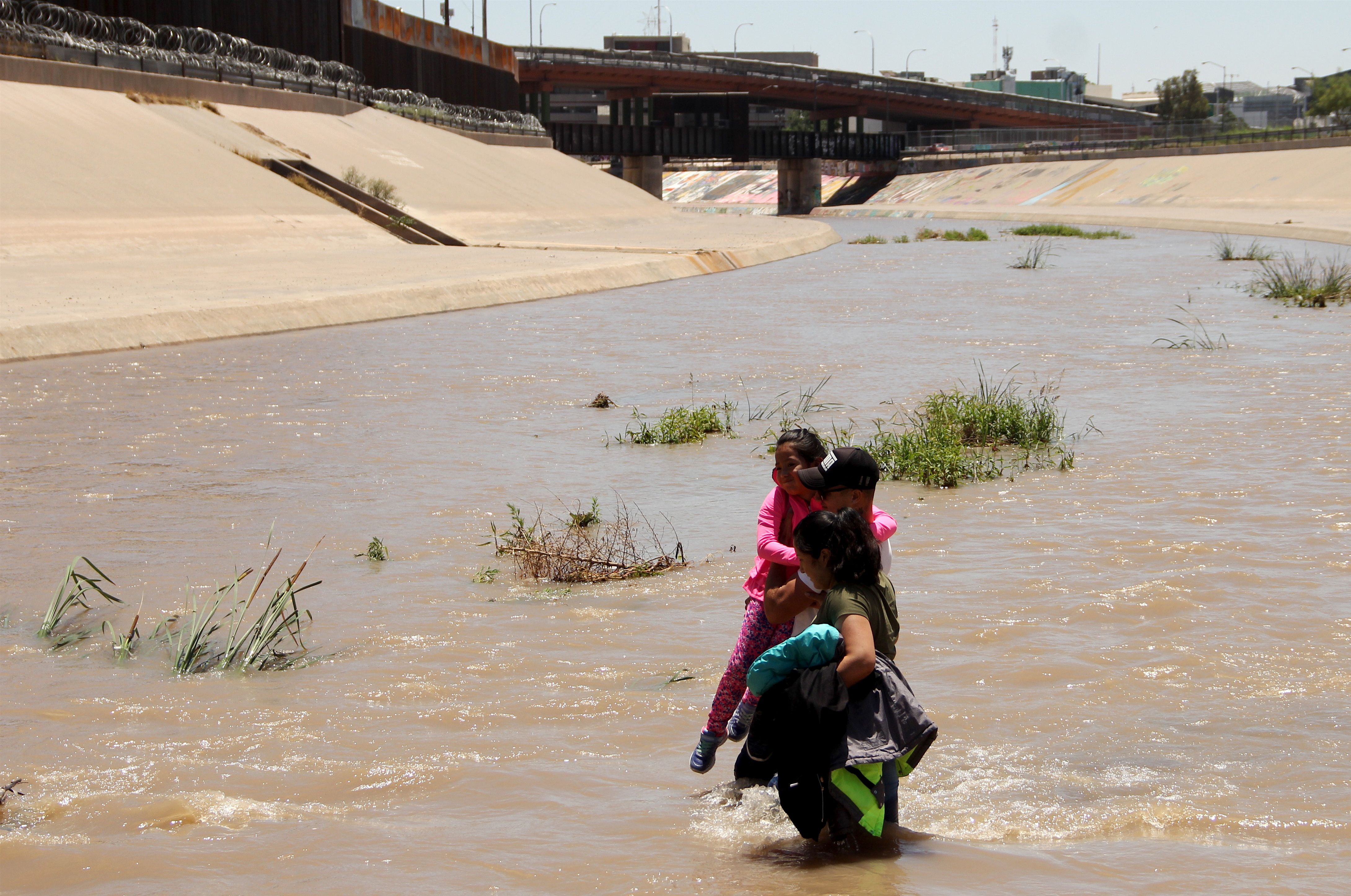 Central American migrants cross the Rio Grande in Ciudad Juarez, on June 12, 2019, before turning themselves into U.S. Border Patrol agents to claim asylum. (Herika Martinez—AFP/Getty Images)