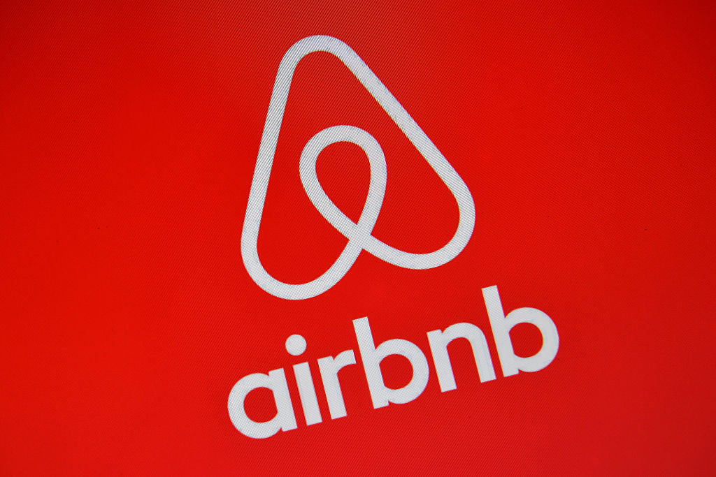 The Airbnb logo is displayed on a computer screen on August 3, 2016 in London, England. (Carl Court&mdash;Getty Images)