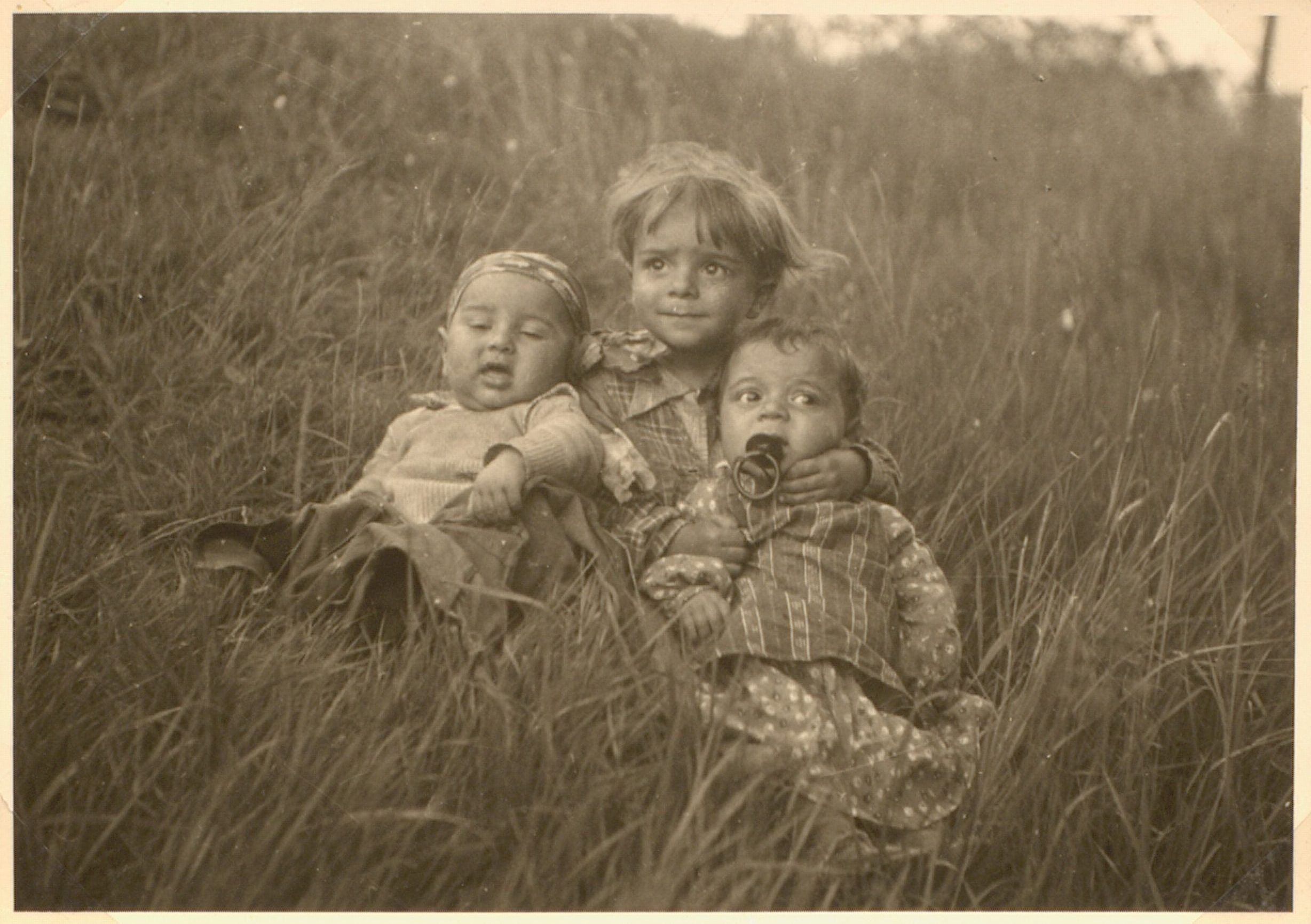 August, a Sinti boy (center), and relatives in Germany. August died in Auschwitz concentration camp, as almost certainly did the other children. (University of Liverpool, GLS Add GA 1 2)