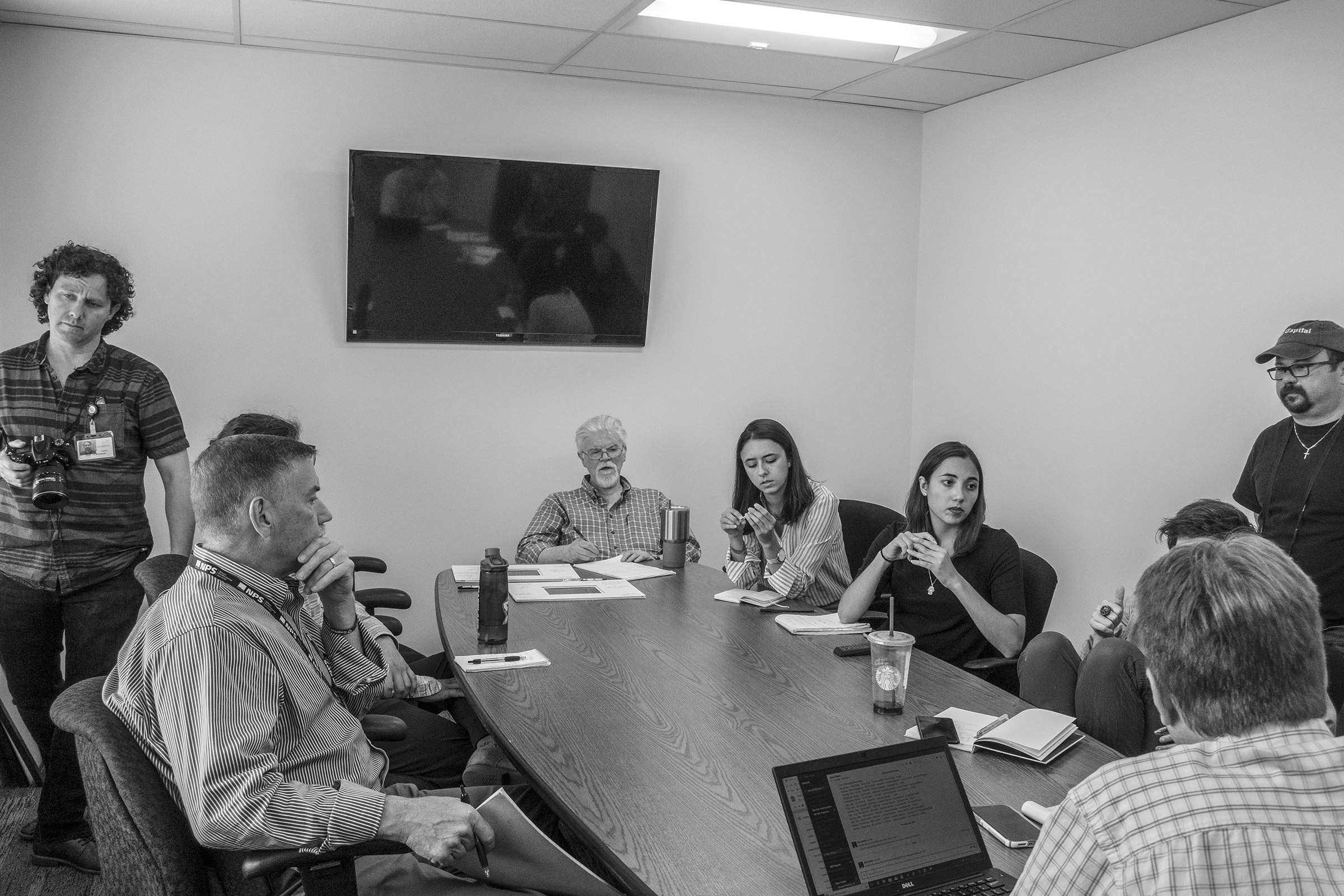 The staff of the Capital Gazette at a meeting about how to cover the one year anniversary of the shooting, June 5, 2019. (Moises Saman—Magnum Photos for TIME)