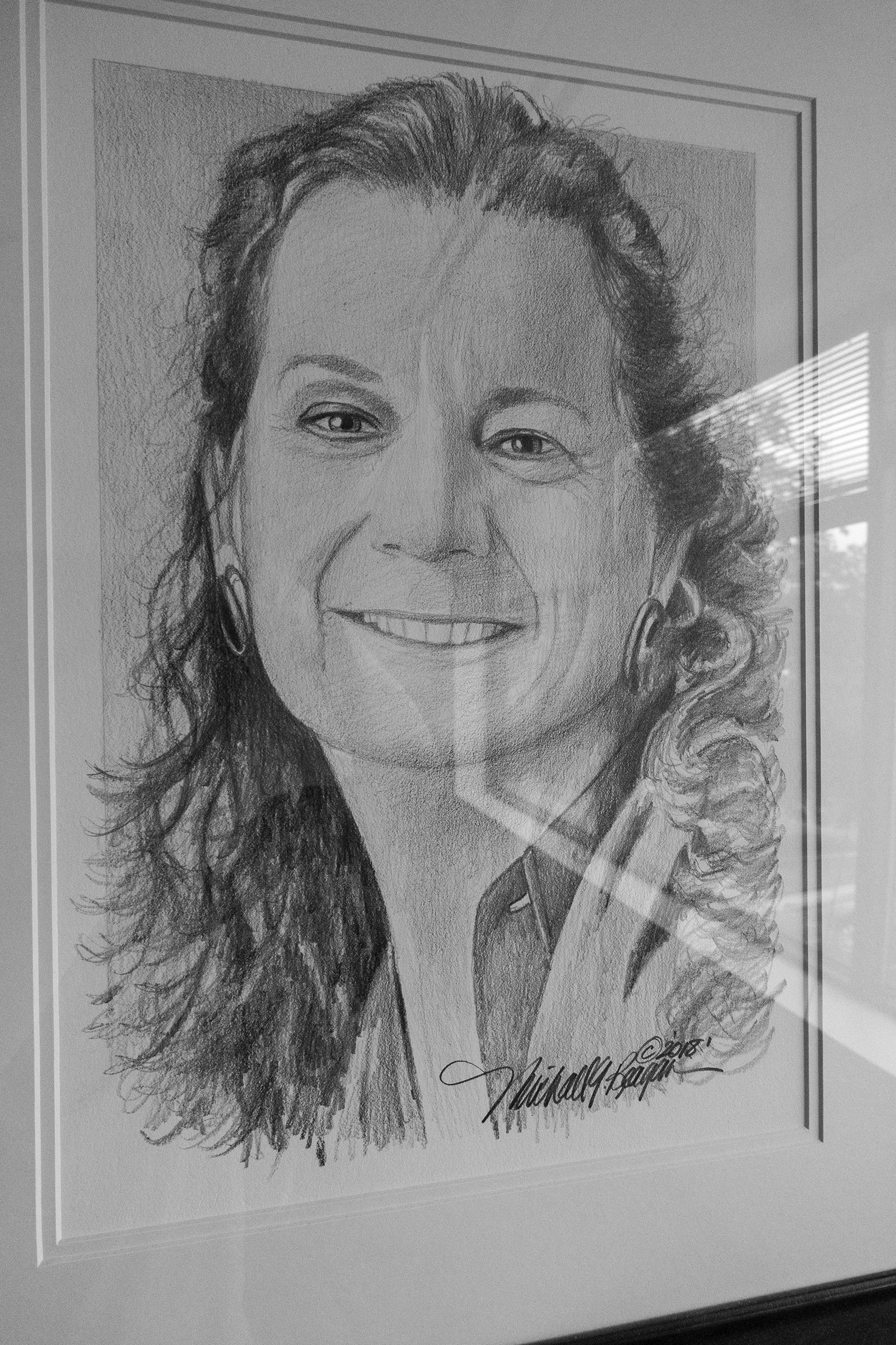 A drawing of shooting victim, Wendi Winters, hangs in the conference room at the new office. (Moises Saman—Magnum Photos for TIME)