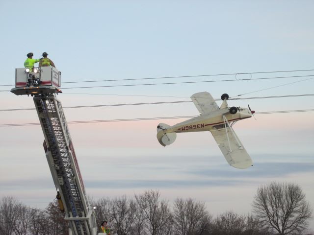 A single-engine Piper Cub propeller plane that became entangled with power lines in Louisville Township, Minnesota on Saturday. (Photo Courtesy of the Scott County Sheriff's Office)