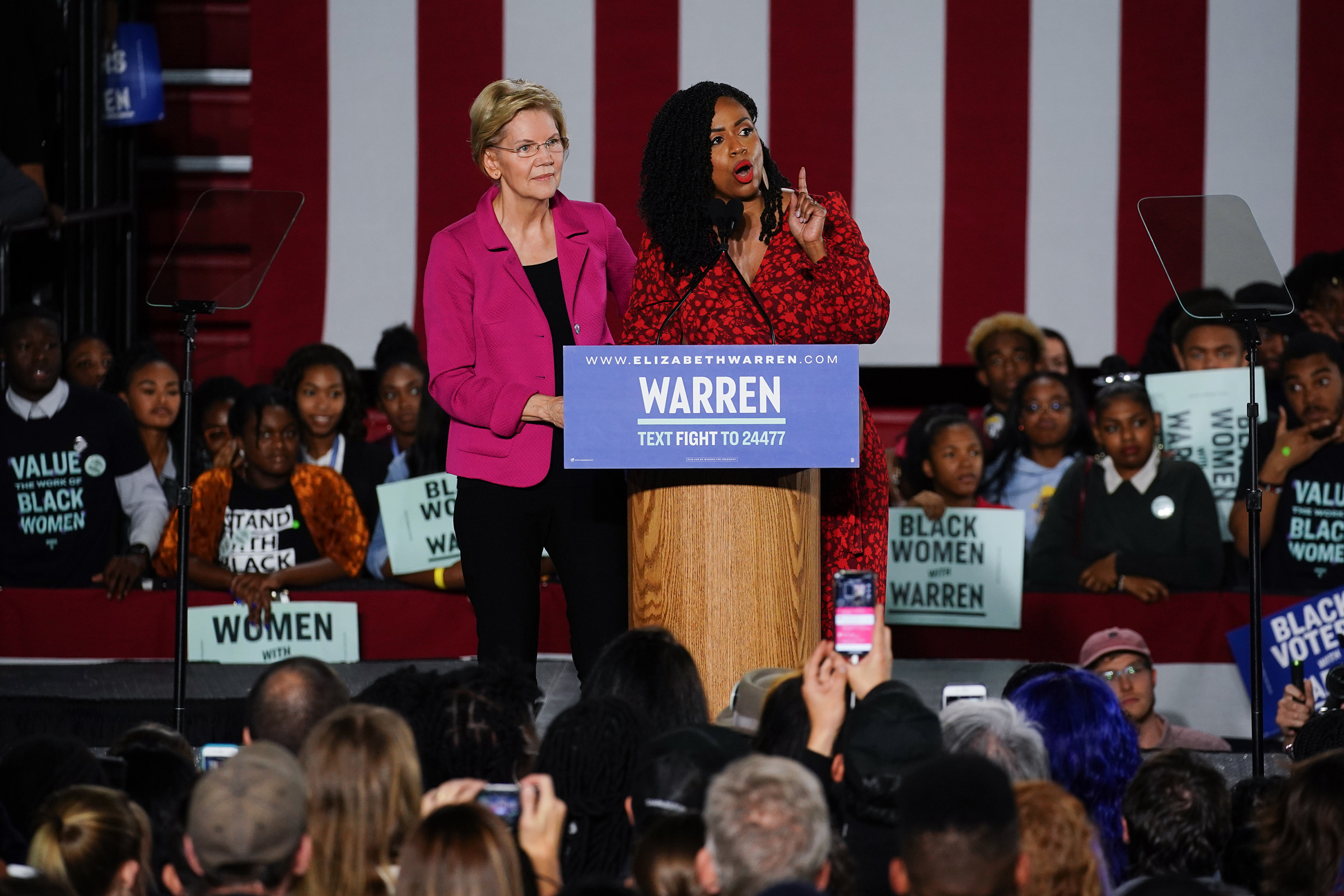 Democratic presidential candidate Sen. Elizabeth Warren (D-MA), stands with U.S. Rep. Ayanna Pressley (D-MA) as she addresses a group of protesters during a campaign event at Clark Atlanta University on Nov. 21, 2019. (Elijah Nouvelage—Getty Images)