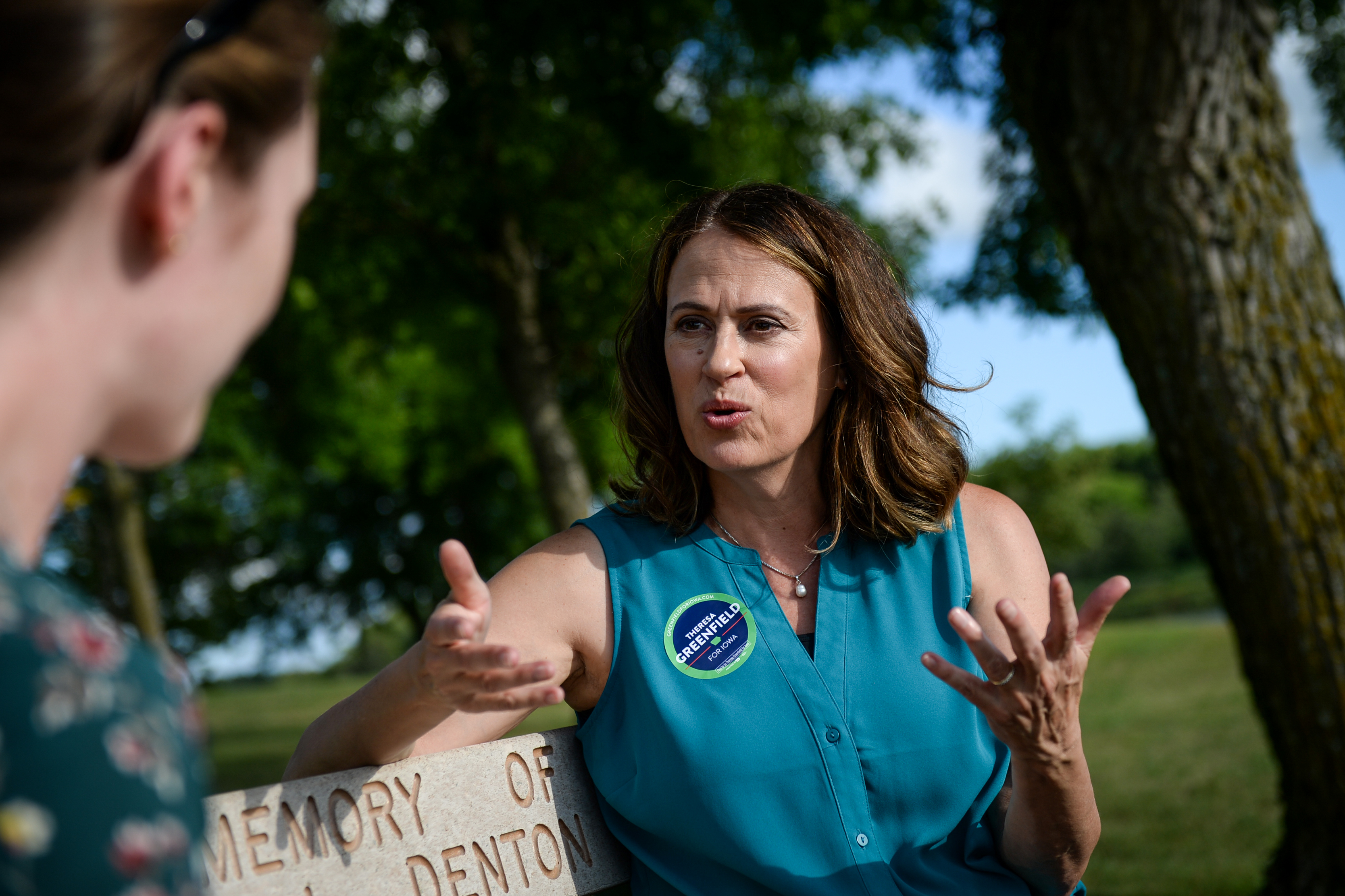 Democratic senate candidate Theresa Greenfield speaks with a reporter at a picnic hosted by the Adair County Democrats in Greenfield, Iowa on Sunday August 11, 2019. (Caroline Brehman—CQ-Roll Call, Inc via Getty Images)