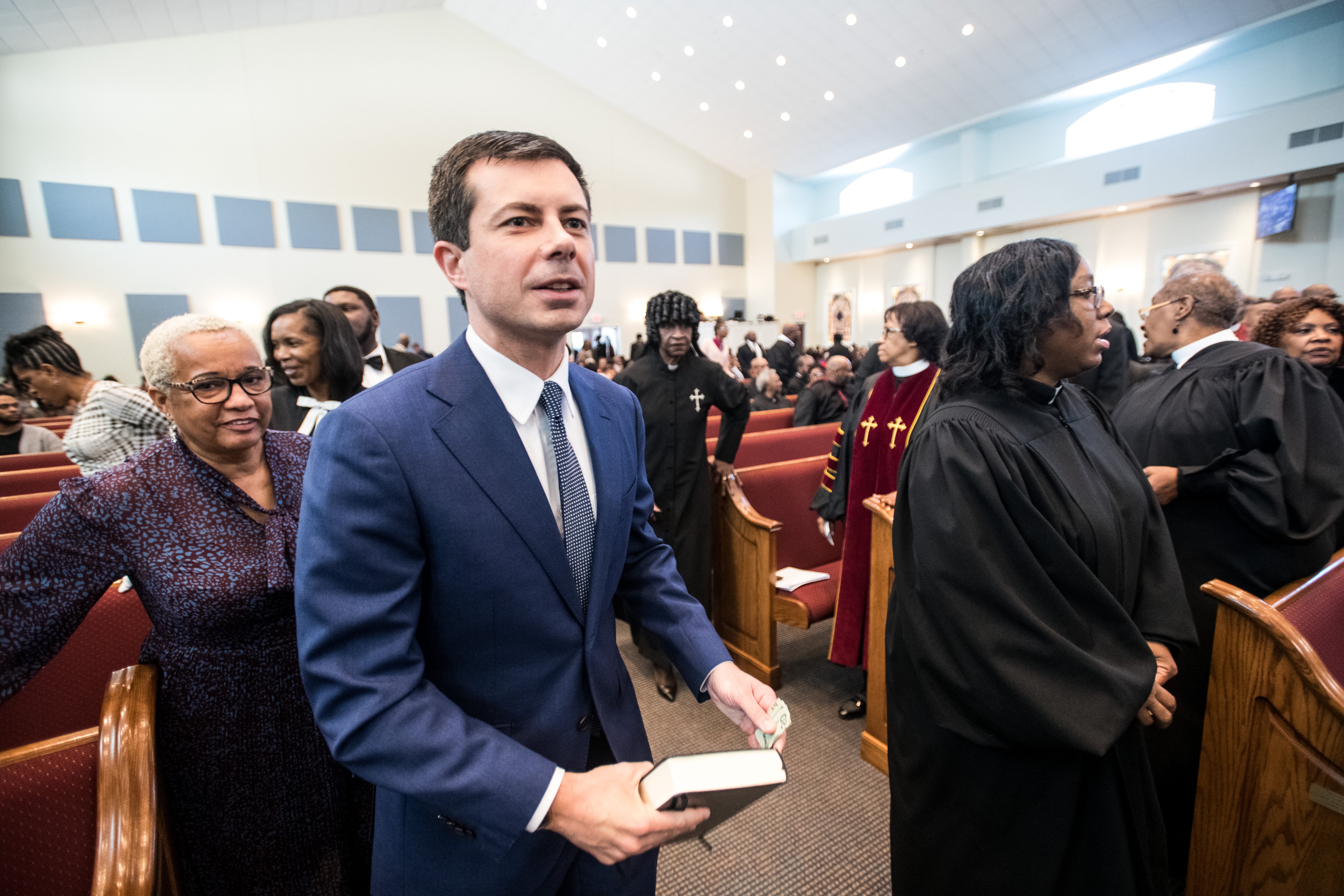 Democratic presidential candidate, South Bend, Indiana Mayor Pete Buttigieg exits a church pew during Sunday service at the Kenneth Moore Transformation Center in Rock Hill, South Carolina on Oct. 27, 2019. (Sean Rayford—Getty Images)