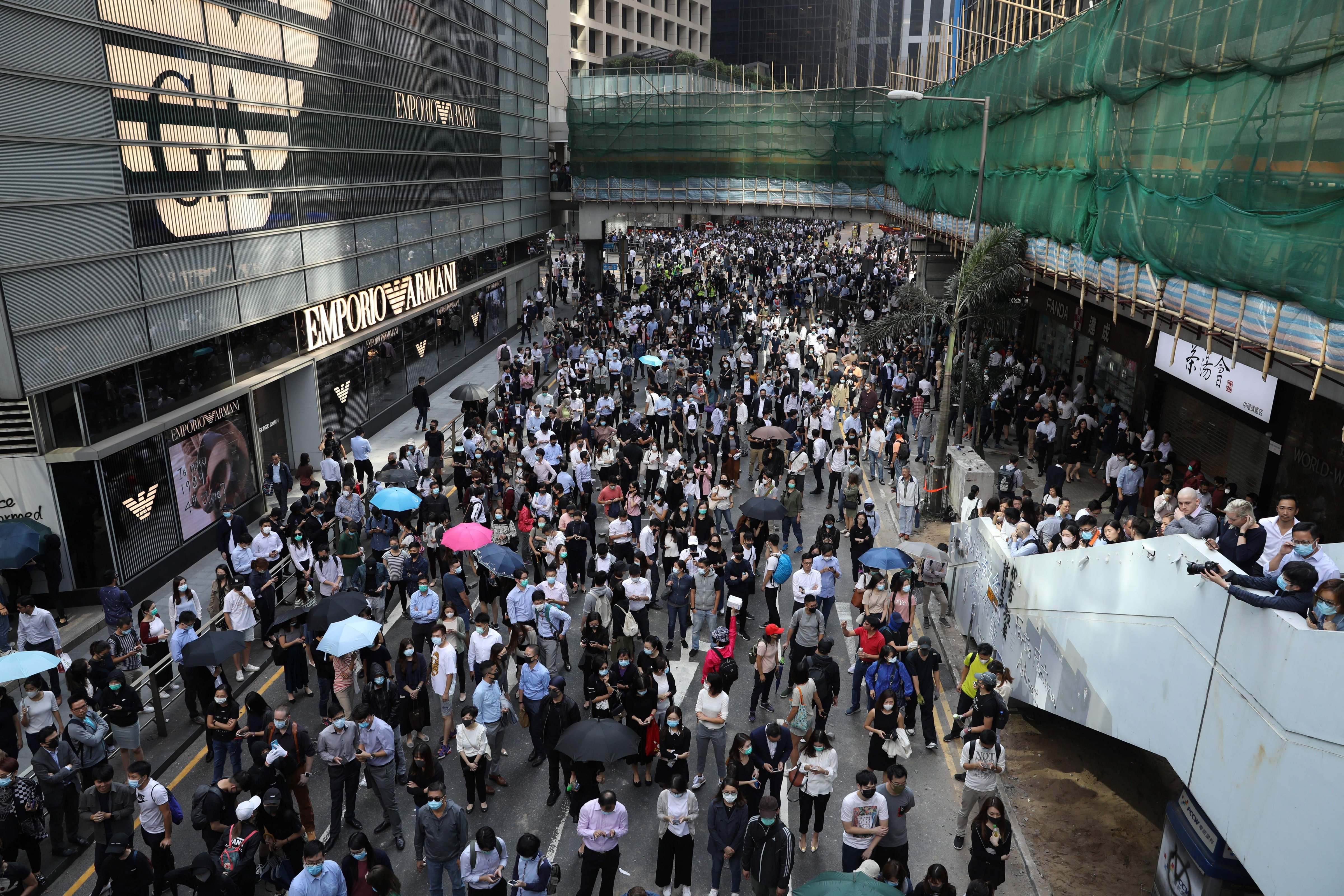 Protesters and office workers gather during a protest in the Central district of Hong Kong on November 13, 2019. (DALE DE LA REY—AFP via Getty Images)