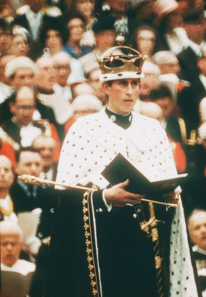 Prince Charles, wearing the gold coronet of the Prince of Wales, looks on at his investiture as Prince of Wales on July 1, 1969 in Caernarvon, Wales. (Anwar Hussein—Getty Images)