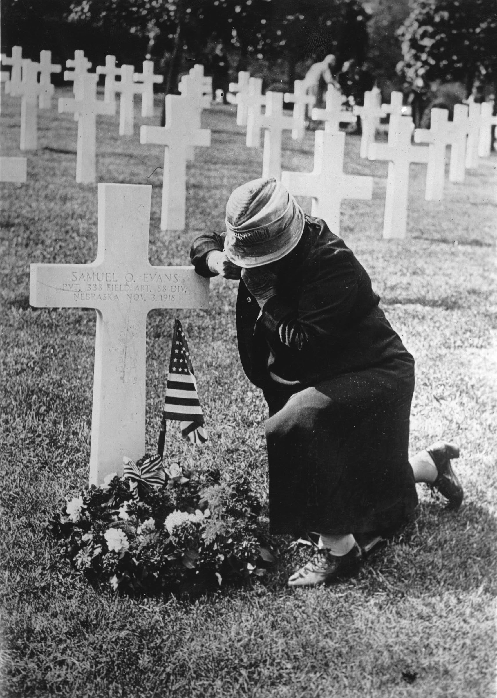 A mother of a soldier at the grave of her son, France, Photograph, Around 1920