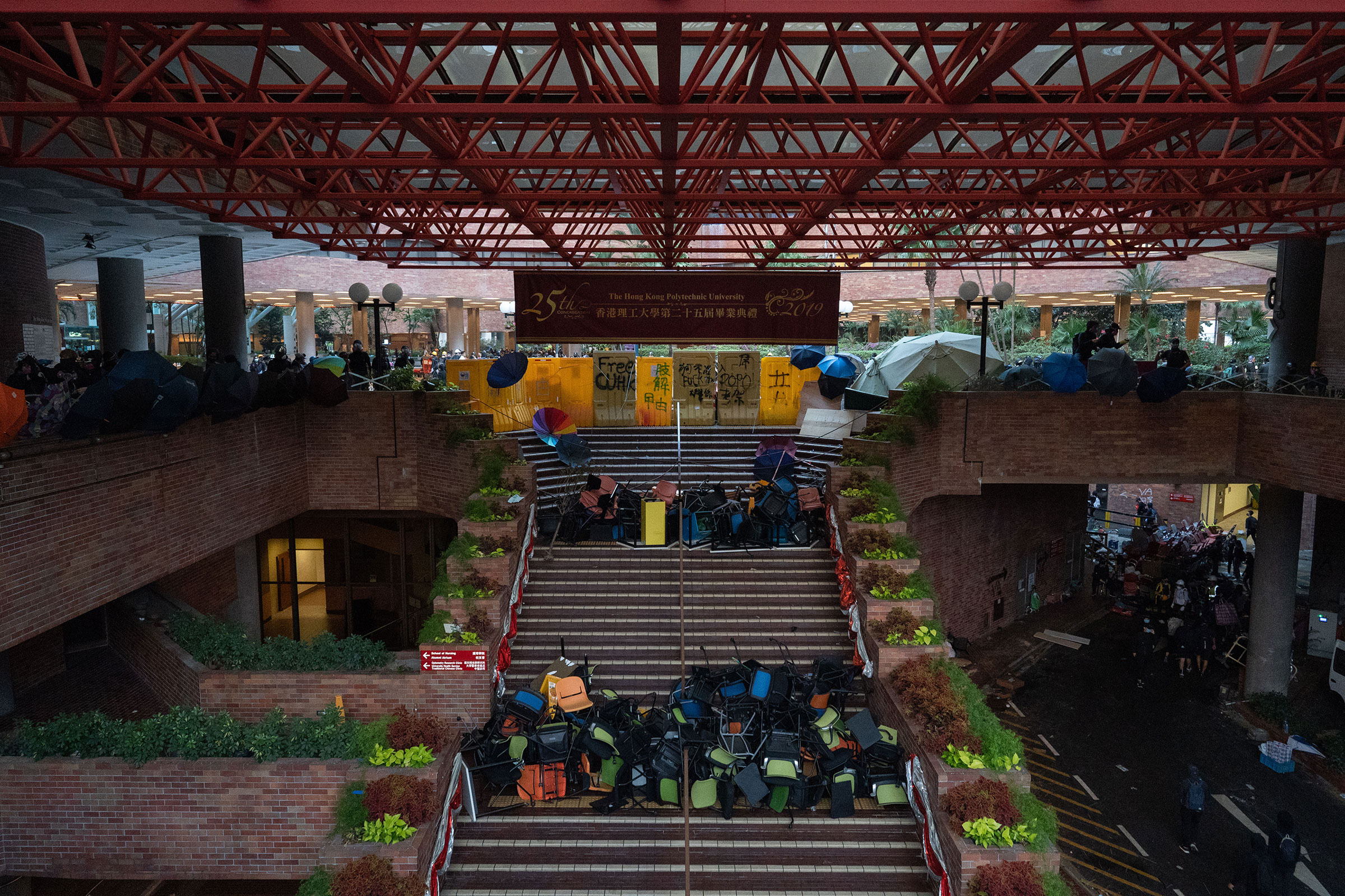 Polytechnic University's main atrium, fortified with umbrellas and barricades, Nov. 14.